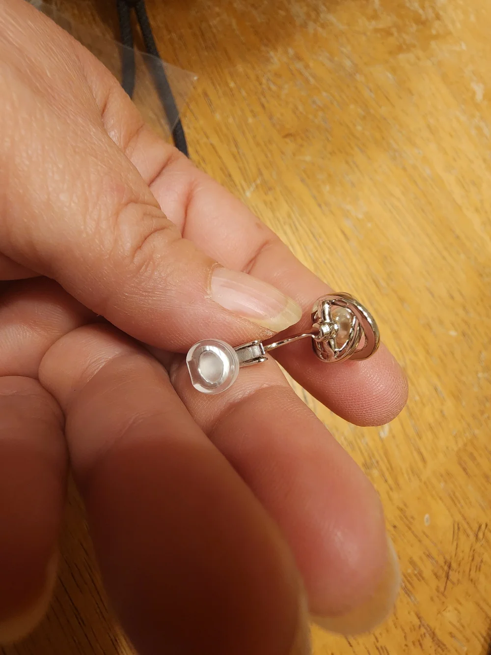 classic Swarovski Crystal Pearl clip ons featuring a central cream faux pearl